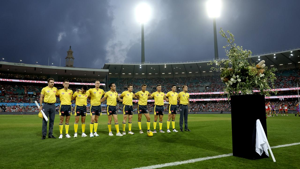 Umpires pay to tribute to Jesse Baird and Luke Davies during the AFL Opening Round match between the Sydney Swans and Melbourne Demons at the SCG on March 7, 2024. Picture: Phil Hillyard