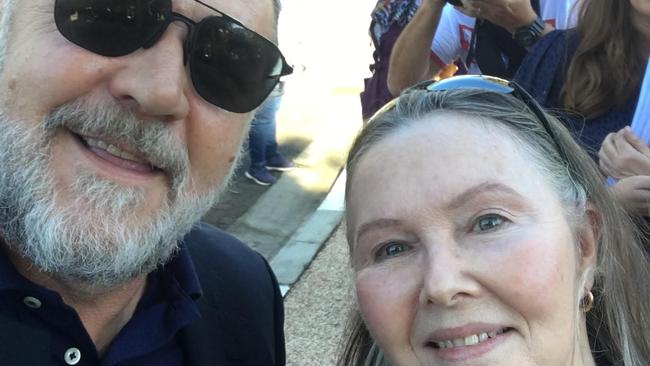 Brigit Mackenzie, 69 - posing with Russell Crowe - has desperately tried to get her husband into an aged care centre to match his high needs. Picture: supplied