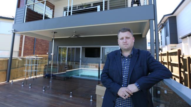 David Adams at his unfinished Q1 home at Wavell Heights. Pic Annette Dew