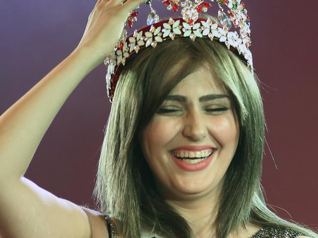 Newly crowned Miss Iraq Shaima Qassim, 20, left, as she celebrates after being crowned the end of the 2015 Miss Iraq Final, in Baghdad, Iraq, Saturday, Dec. 19, 2015. (AP Photo/Karim Kadim)