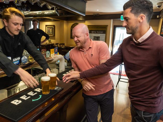 Alex Cooper (centre) says it’s frustrating that beers are becoming more expensive. Picture: Jason Edwards