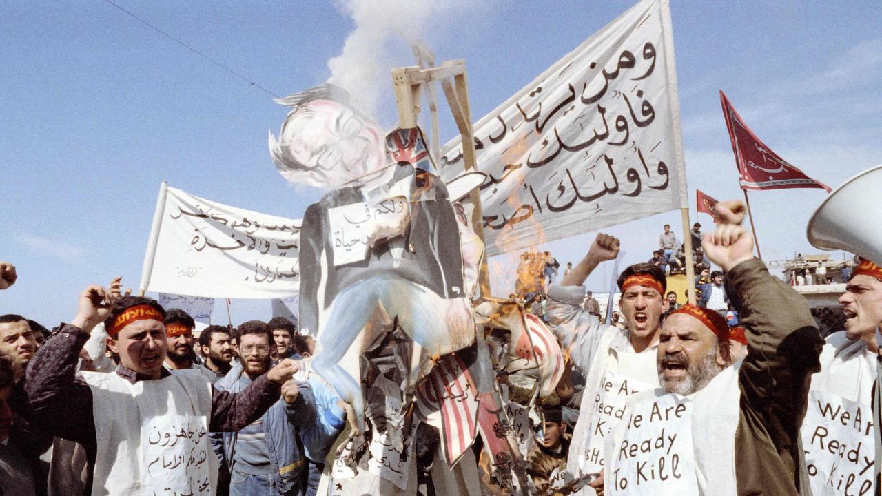 Iranian fundamentalists burn an effigy of Rushdie in 1989. Picture: Nabil Ismail/AFP