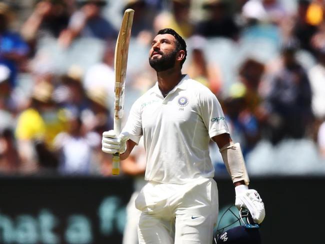 Indian star Cheteshwar Pujara reaches his century.