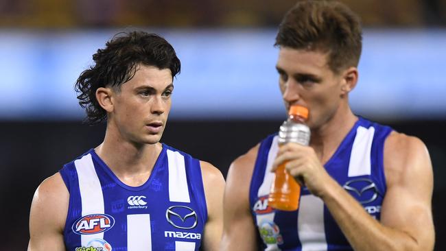 Jasper Pittard and Shaun Atley show their disappointment after North Melbourne’s Good Friday hiding. Picture: AAP Image/Julian Smith. 