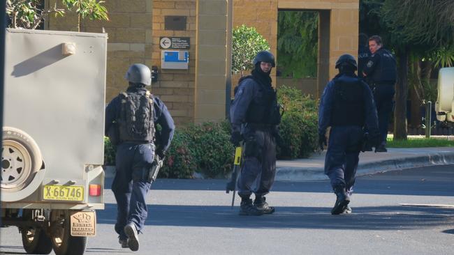 Wagga police accessing Quest Apartments. Picture: Toby Vue