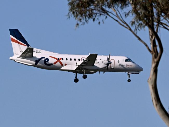 A Rex Airlines Saab 340B prepares to land at Melbourne's Tullamarine Airport on July 30, 2024 after the Australian regional airline announced a trading halt and thus fuelling speculations of financial challenges. (Photo by William WEST / AFP)