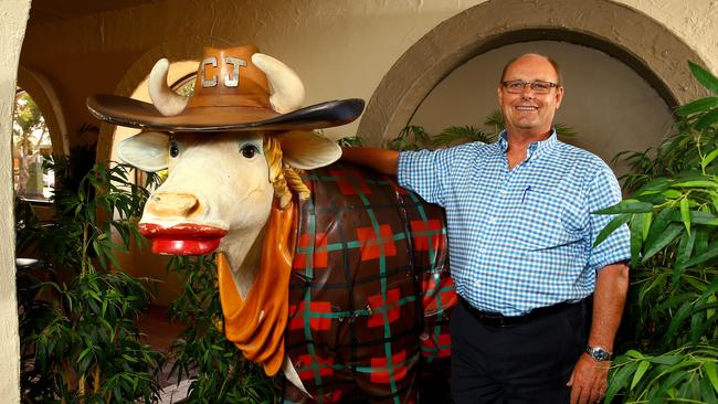 Richard Cavill owner of Cav's Steakhouse with one of his iconic cows. Pic by David Clark