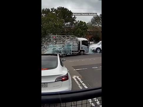 Shocking moment truck carrying glass is hit by two cars