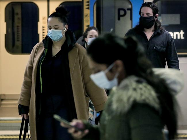 People are seen wearing face masks on public transport at Parliament Station July 23, 2020 in Melbourne. Picture: Darrian Traynor/Getty Images