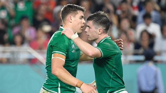 Ireland's centre Garry Ringrose (L) celebrates with Ireland's scrum-half Luke McGrath after scoring a try during the Japan 2019 Rugby World Cup Pool A match between Ireland and Russia at the Kobe Misaki Stadium in Kobe on October 3, 2019. (Photo by Filippo MONTEFORTE / AFP)