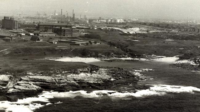 Southeast Sydney was a mix of beautiful coastlines and heavy industry. Pictured is Little Bay with the chimneys of Botany in the background.