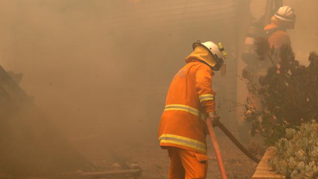 FORCE FOR GOOD: CFS firefighters put out fires at Woodside in the Adelaide Hills Picture: Kelly Barnes/AAP