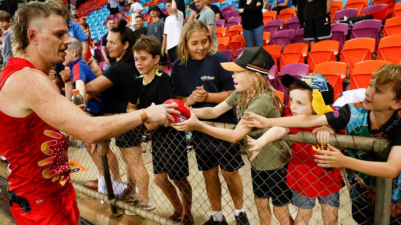 Nick Holman of the Suns celebrates with fans during the 2023 AFL Round 11 match between the Gold Coast Suns and the Western Bulldogs at TIO Stadium. (Photo by Michael Willson/AFL Photos via Getty Images)