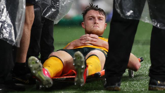 SYDNEY, AUSTRALIA - NOVEMBER 11: Harry Souttar of Australia   looks dejected after being stretchered from the field during the FIFA World Cup AFC Asian Qualifier match between the Australia Socceroos and Saudi Arabia at CommBank Stadium on November 11, 2021 in Sydney, Australia. (Photo by Mark Kolbe/Getty Images)