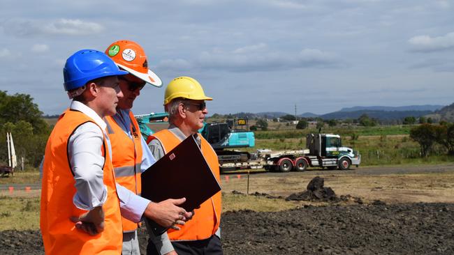 WORK UNDERWAY: Lismore City Council mayor Isaac Smith, SEE Civil project manager Michael Williams and Cr Bill Moorhouse inspect the earthworks of the South Lismore Flood Mitigation project in 2019. Photo: Jackie Munro