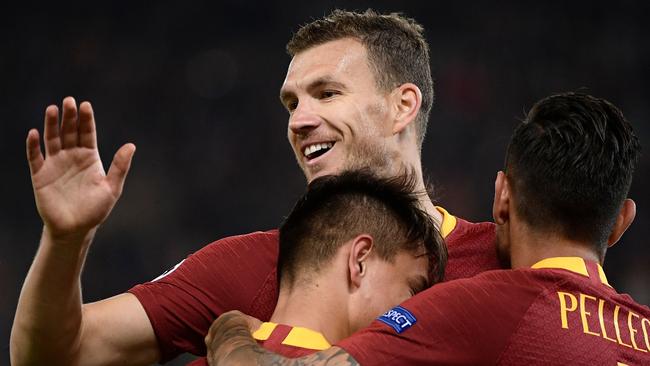 Edin Dzeko celebrates with his Roma teammates. Picture: AFP
