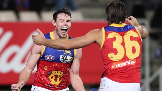 Lachie Neale celebrates with teammates after kicking a goal. Picture: AFL Photos/via Getty Images