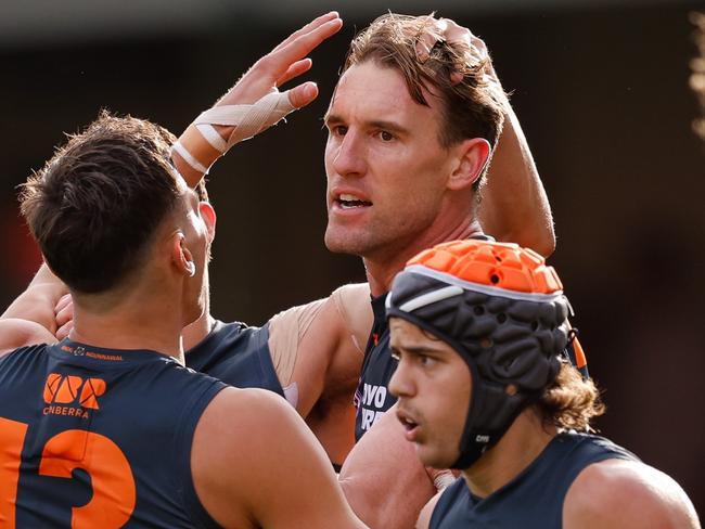 SYDNEY, AUSTRALIA – SEPTEMBER 07: Lachlan Keeffe of the Giants celebrates a goal with teammates during the 2024 AFL First Qualifying Final match between the Sydney Swans and the GWS GIANTS at The Sydney Cricket Ground on September 07, 2024 in Sydney, Australia. (Photo by Dylan Burns/AFL Photos via Getty Images)