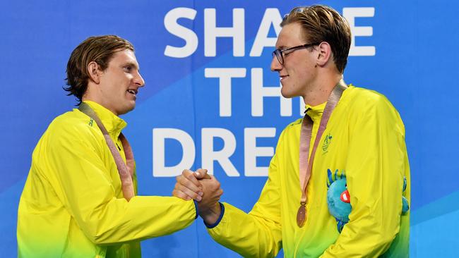 Gold medallist Jack McLoughlin (left) with bronze medallist Mack Horton after the 1500m on Tuesday night.