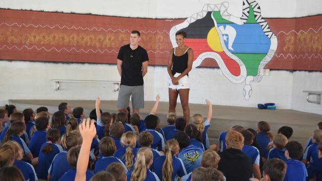 Cannonvale State School students meet Collingwood player Mason Cox and Collingwood Magpies and England Rose netballer Geva Mentor. Photo: Elyse Wurm