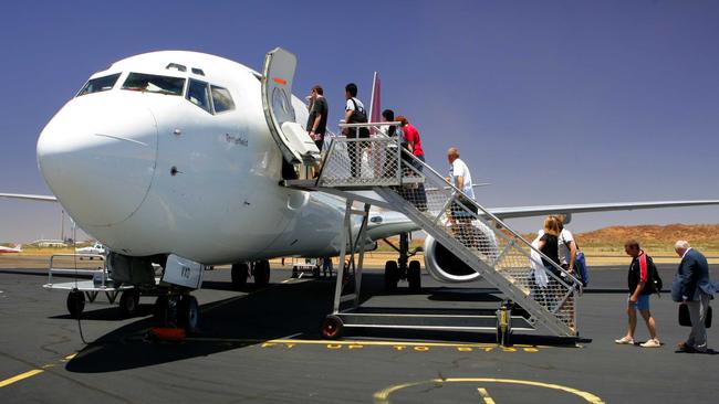 Passengers board a Qantas 737 at Mount Isa Airport.