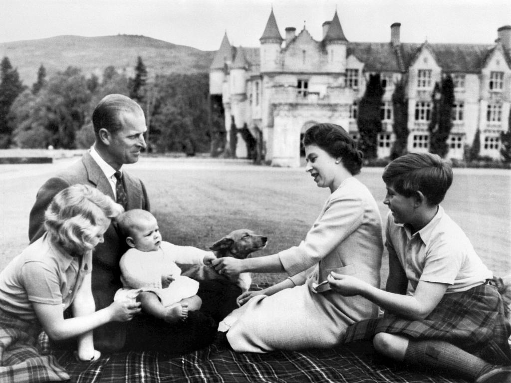 1960: The Queen, Prince Philip and children Prince Charles, Princess Anne and Prince Andrew as a baby in the grounds of Balmoral Castle, September 9, 1960. Picture: AFP