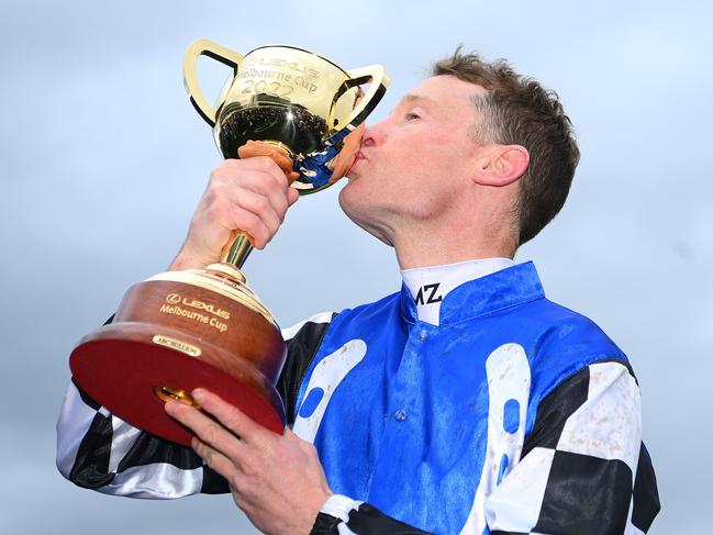 MELBOURNE, AUSTRALIA - NOVEMBER 01: Mark Zahra who rode Gold Trip celebrates with the trophy after winning race seven, the Lexus Melbourne Cup during 2022 Lexus Melbourne Cup Day at Flemington Racecourse on November 01, 2022 in Melbourne, Australia. (Photo by Quinn Rooney/Getty Images)