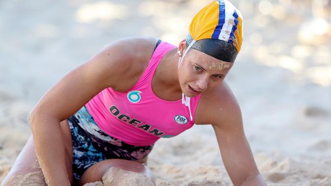 Kurrawa's Claudia Slaven just misses qualifying for the opening round of the Nutri-Grain Ironwoman Series at Queenscliff, NSW after falling in a sprint to the line during the heats repechage. Photo: Shane Myers