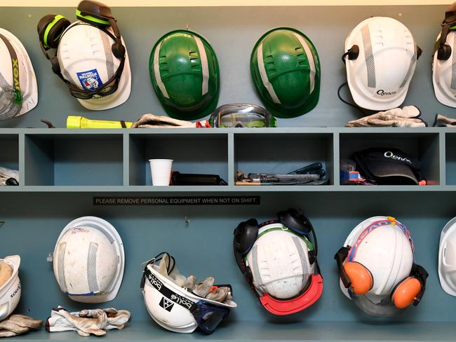 Workers helmets and safety equipment on display at the Qenos Altona plant in Melbourne, Monday, August 28, 2017. Earlier the Federal Opposition Leader Bill Shorten joined local Labor members, Joanne Ryan and Tim Watts on a tour at Qenos Altona Gas plant. (AAP Image/Joe Castro) NO ARCHIVING