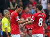 MANCHESTER, ENGLAND - SEPTEMBER 14: Angel Di Maria of Manchester United is congratulated by team-mate Juan Mata after scoring the first goal during the Barclays Premier League match between Manchester United and Queens Park Rangers at Old Trafford on September 14, 2014 in Manchester, England. (Photo by Alex Livesey/Getty Images)