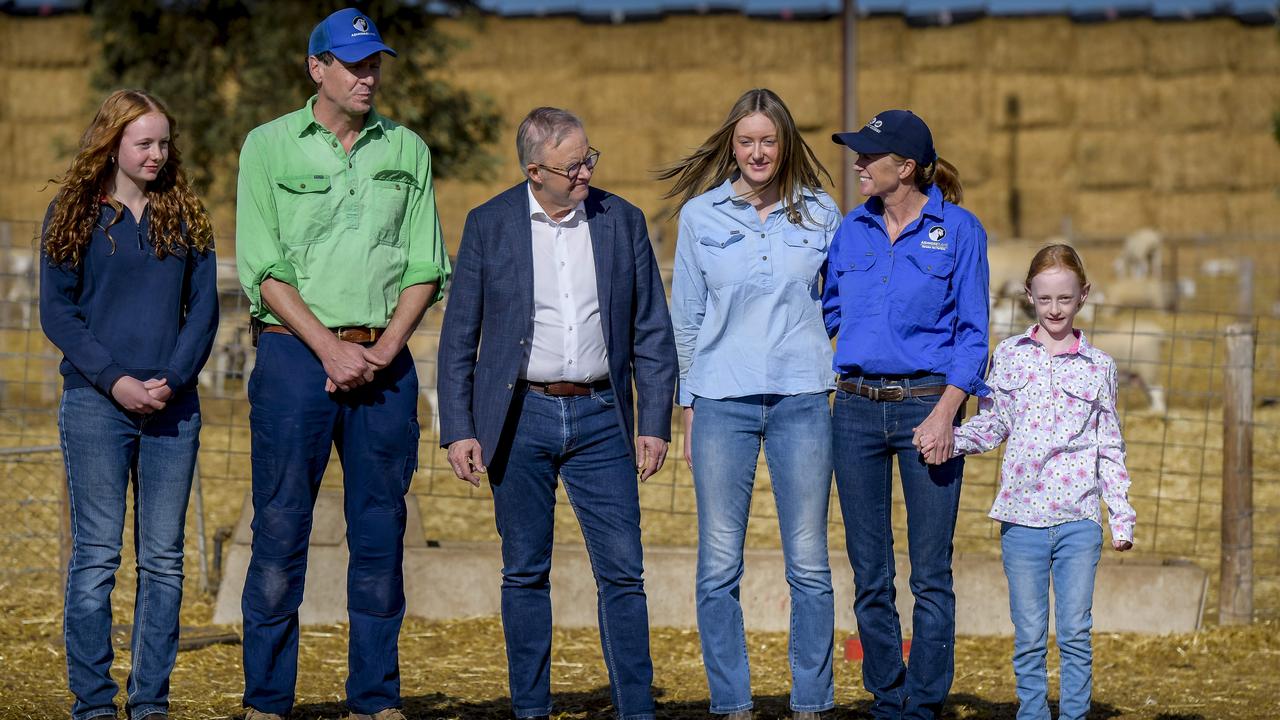 Prime Minister Anthony Albanese with the Fischer family Troy and Nette Fischer, Isabelle (16), Indigo (14) and Elke (9) at their property at Fischer, north of Adelaide. Picture: NewsWire/Roy VanDerVegt