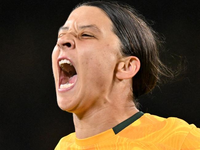 FILES-- This file photo taken on August 16, 2023 shows Australia's forward Sam Kerr celebrating scoring her team's first goal during the Australia and New Zealand 2023 Women's World Cup semi-final football match between Australia and England at Stadium Australia in Sydney. Chelsea and Australian women's football star Sam Kerr has been charged with a "racially aggravated offence" in Britain following a dispute involving a police officer, London's Metropolitan Police said March 4.  The 30-year-old striker, one of the highest profile and best-paid players in the women's game, was charged following an incident in London in January 2023, a police statement read. (Photo by IZHAR KHAN / AFP)