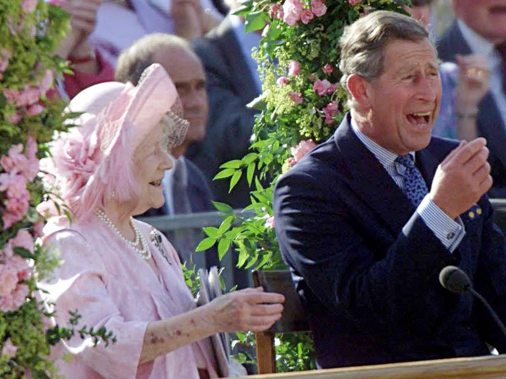 Prince Charles shares a laugh with his grandmother, the Queen Mother, while watching a special pageant on Horseguards Parade in London to mark her 100th birthday. The celebration was held in July 2000, a couple of weeks before her actual birthday on August 4, but the crowds were out again on the day itself, cheering outside Clarence House as she received her telegram from the Queen. Picture: AP