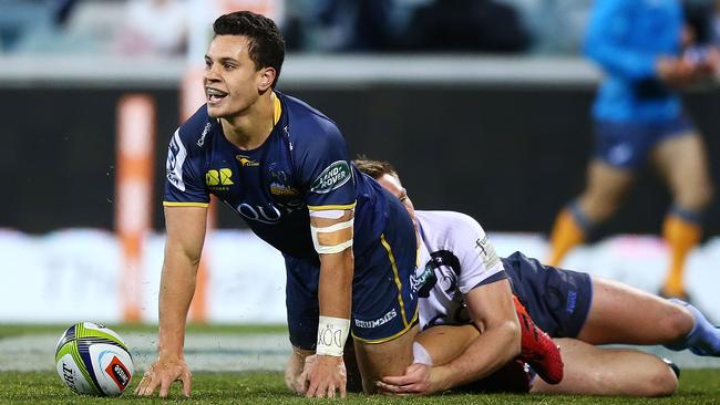 Matt Toomua celebrates scoring against the Force.