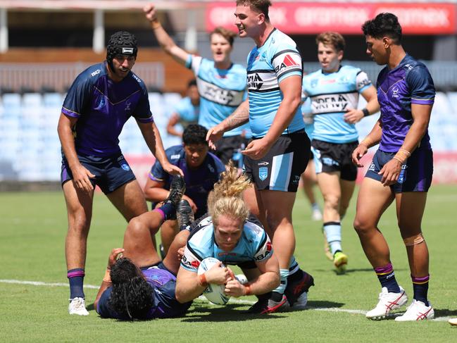 Samuel McCulloch scores despite the best efforts of the Storm's Josiah Ekkehard Neli in the SG Ball Cup. Picture: Steve Montgomery/Ourfootyteam.com