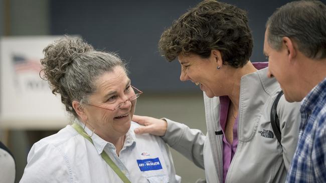 Democratic congressional candidate Amy McGrath greets a supporter while waiting to vote  in Georgetown, Kentucky. Picture: AP.