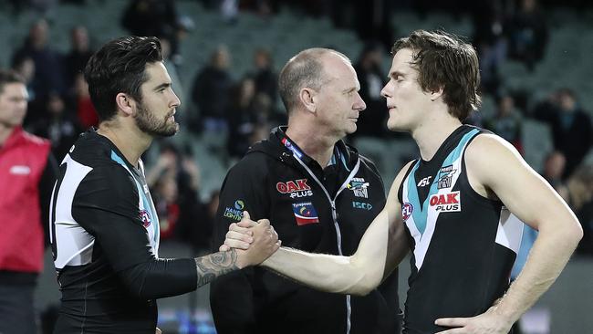 Chad Wingard with the departing Jared Polec and Port Adelaide coach Ken Hinkley after the Power’s final game of the 2018 season. Picture Sarah Reed