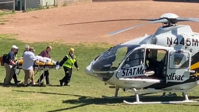 Salman Rushdie is seen being loaded onto a medical evacuation helicopter near the Chautauqua Institution after being stabbed in the neck while speaking on stage. Picture: AFP