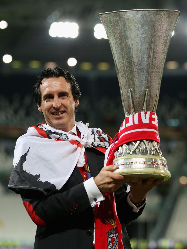 Unai Emery poses with the Europa League trophy.