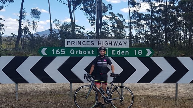 Mick Day in front of sign