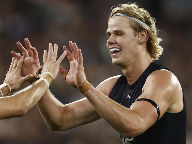 MELBOURNE, AUSTRALIA - MARCH 23: Zac Fisher of the Blues (L) celebrates with Tom De Koning of the Blues after kicking a goal during the round two AFL match between Carlton Blues and Geelong Cats at Melbourne Cricket Ground, on March 23, 2023, in Melbourne, Australia. (Photo by Daniel Pockett/Getty Images)