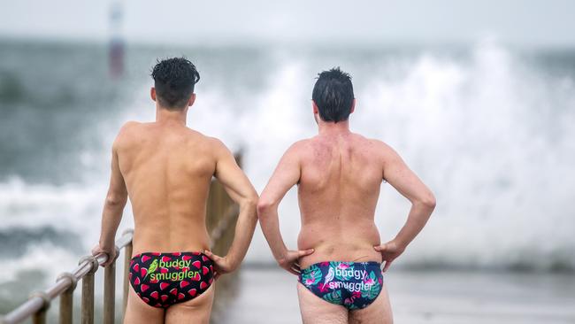 Budgy smugglers make an appearance at Middle Park beach despite the weather. Picture: Sarah Matray