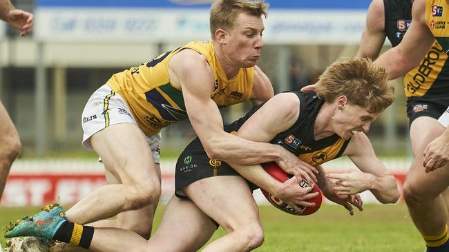 Eagle Joseph Sinor lays a crunching tackle on Tiger Cooper Horsnell at the Bay on Saturday. Picture: Matt Loxton