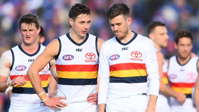 Jake Kelly and Paul Seedsman of the Crows look dejected after losing the round 23 match to the Western Bulldogs. Picture: Getty Images