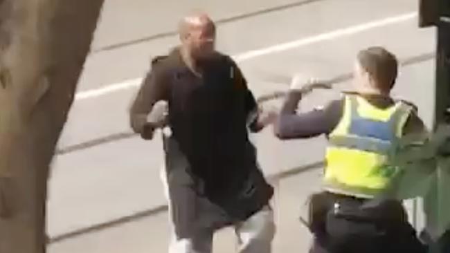 A screenshot taken from a supplied video made available to AAP on Friday, November 9, 2018 showing an incident on Bourke Street in Melbourne, Friday, November 9, 2018. (AAP Image/Supplied to AAP) NO ARCHIVING, EDITORIAL USE ONLY