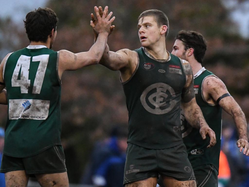 Greensborough players celebrate a goal. Pictures: Nathan McNeill.