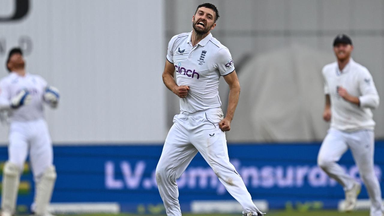 Mark Wood celebrates after taking the wicket of Pat Cummins. Picture: AFP Images