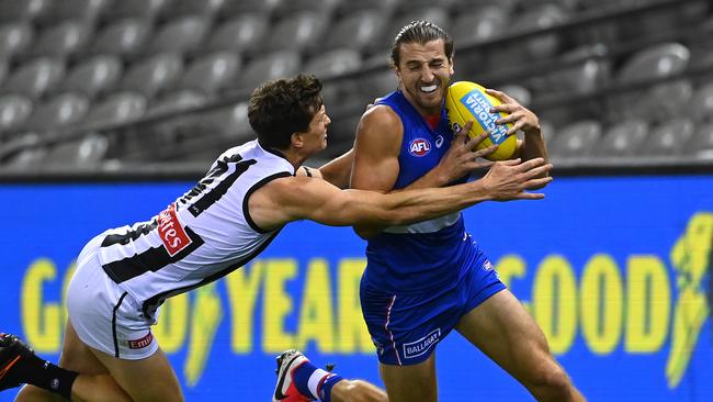 Marcus Bontempelli tries to break a Brody Mihocek tackle. Picture: Getty Images