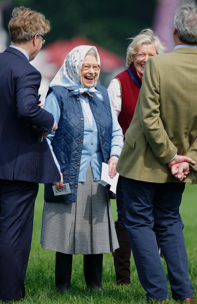 Queen Elizabeth II laughs as she receives a Tesco gift card after her horse Barber's Shop wins at the Royal Windsor Horse Show. Picture: Max Mumby/Indigo/Getty