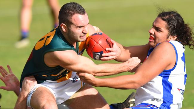 Northcote Park's Mannon Johnston pushes off West Preston-Lakeside's Kane Heaney. Picture: Josie Hayden.